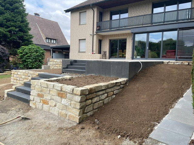 Sandstone dry stone wall with block step staircase and adjoining terrace area